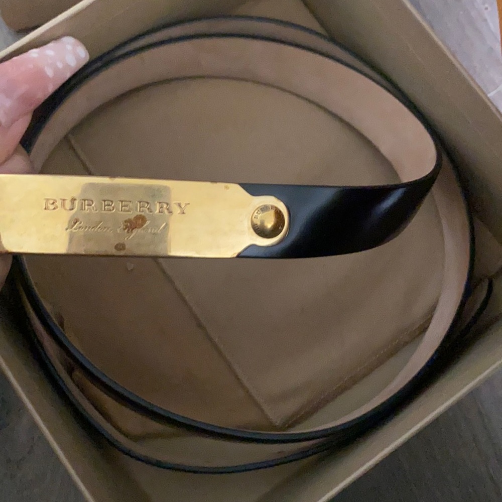Burberry belt never worn has rust mark from just sitting extra belt hole made